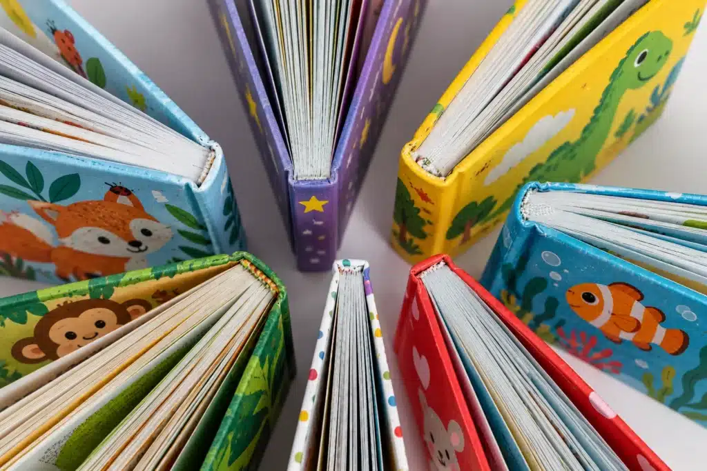 Open children’s books arranged in a circle with illustrated pages facing outward